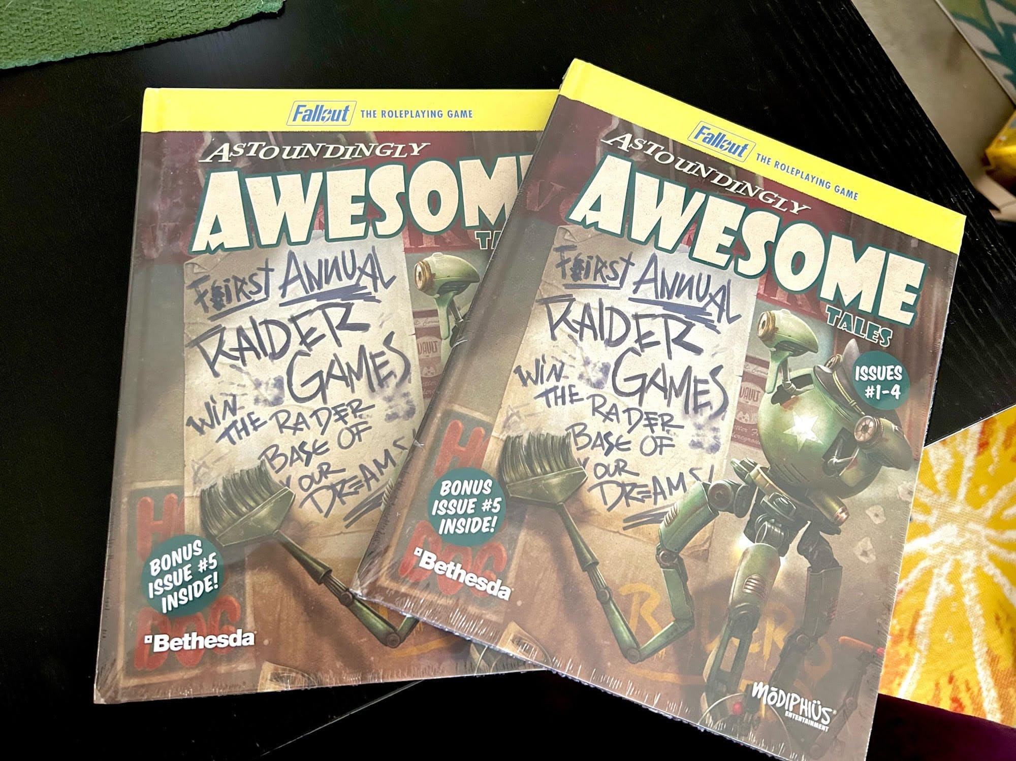 Two copies of Astoundingly Awesome Tales for the Fallout roleplaying game 